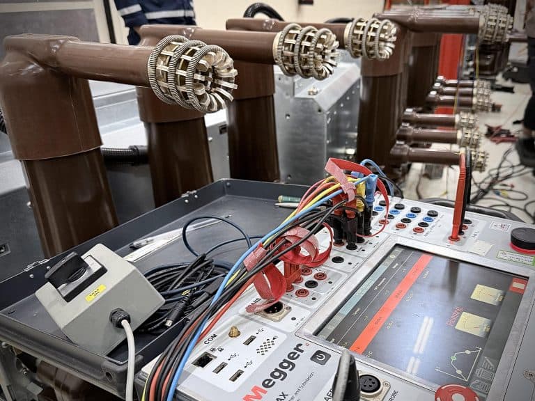 Engineer inspecting medium voltage substation switchgear
